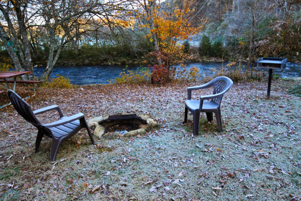 istock Fall time frost, frozen morning and river flowing in front 1076353730