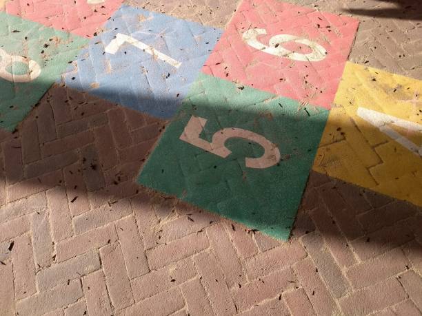 istock Sunshine and shadows over rainbow Hopscotch playfulness 1076355354