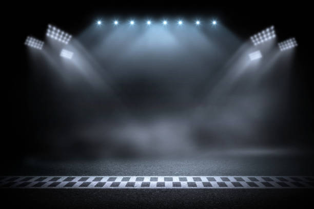 istock Race track finish line racing on night 1076357246