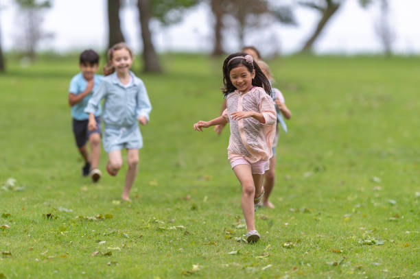 istock Kids playing in the park 1076383614