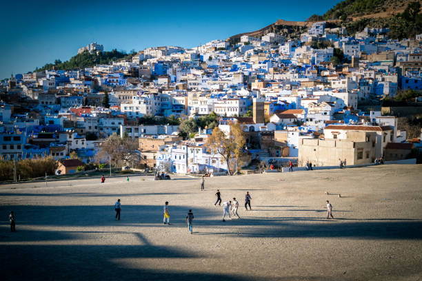 Chefchaouen street view childing playing football stock photo