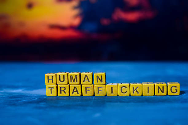 istock Human trafficking on wooden blocks. 1076409734