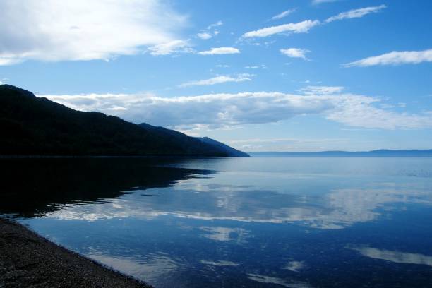 istock Clear and transparent lake Baikal sky reflection 1076413426