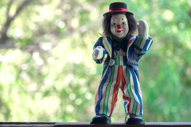 istock Funny clown toy in nature background 1076413694