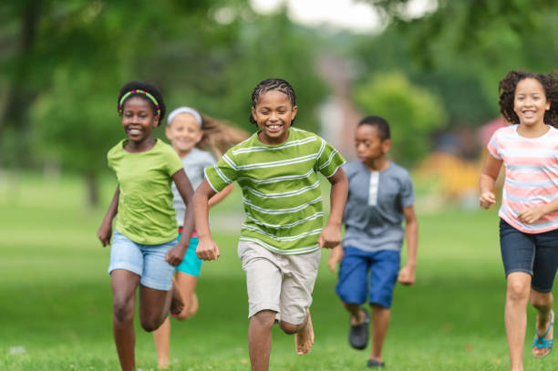 istock Children running at the park 1076425030