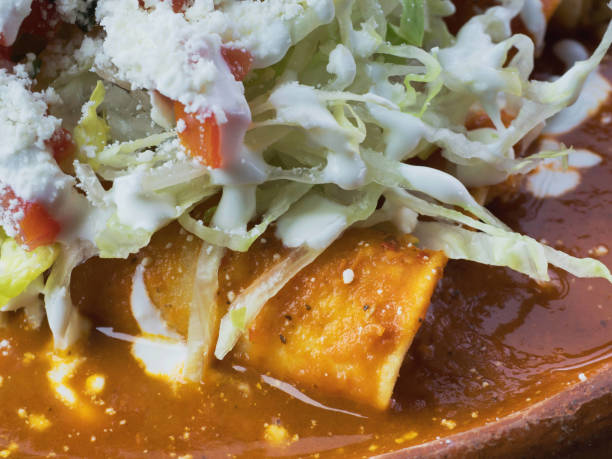 istock Baked Chicken Enchiladas close-up 1076435264