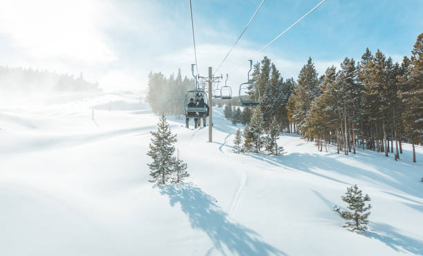 Scenic view of Breckenridge ski resort , Colorado. Breckenridge, United States - December 2, 2018: View of untracked ski slope and ski lift in Breckenridge ski resort. overhead cable car photos stock pictures, royalty-free photos & images