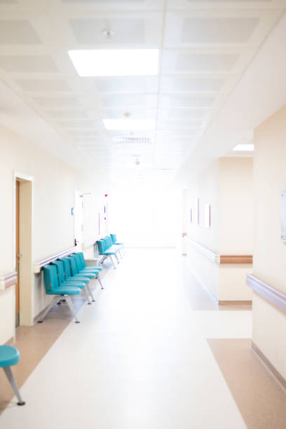 istock Abstract hospital corridor defocused Medical background 1076438830