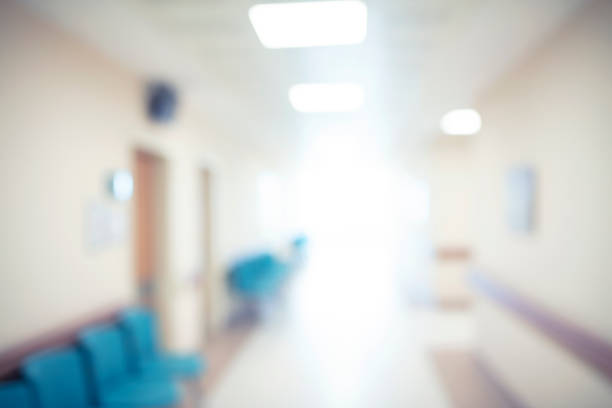 istock Abstract blur hospital corridor defocused Medical background 1076438842