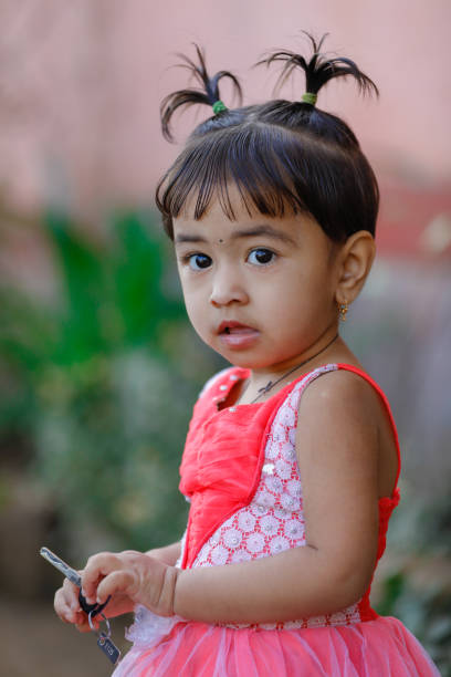 istock indian child playing in wheat field 1076441272