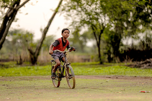 indian child on bicycle