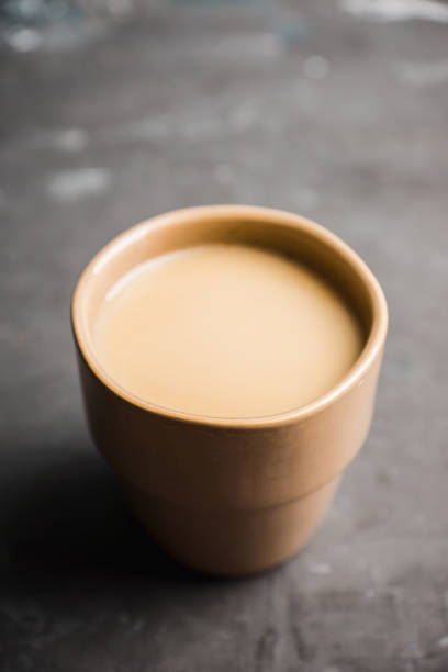 istock Sweet coffee with spices in cup on the rustic background 1076445214