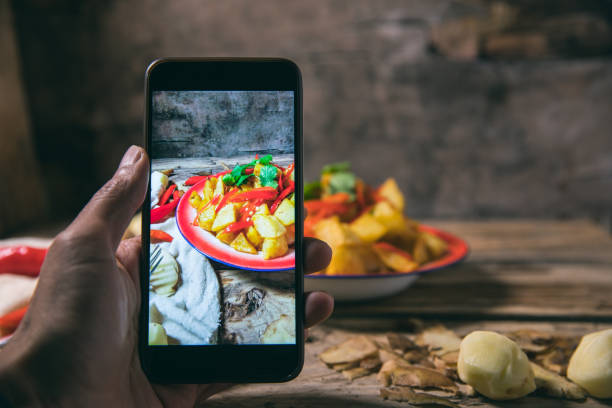 istock Photographing fried potatoes with a smart phone 1076468048