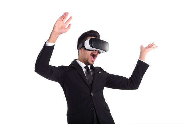istock Young man in suit and virtual glasses isolated on white background. 1076471160