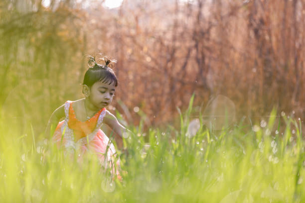 indian child playing in wheat field