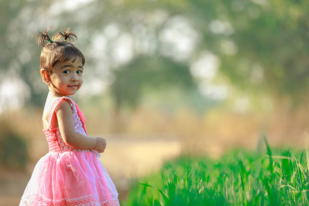 Cute one year old Argentinean girl enjoying outdoors - Buenos Aires Province - Argentina