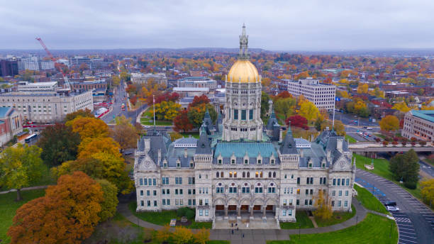 State Capitol Dome Hartford Connecticut Fall Color Autumn Season An aerial view focusing on the Connecticut State House with blazing fall color in the trees around Hartford connecticut state capitol building stock pictures, royalty-free photos & images