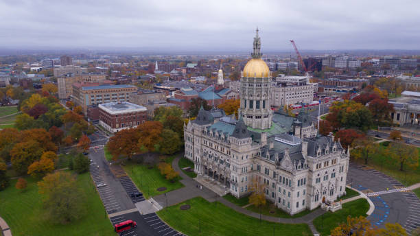 State Capitol Dome Hartford Connecticut Fall Color Autumn Season An aerial view focusing on the Connecticut State House with blazing fall color in the trees around Hartford connecticut state capitol building stock pictures, royalty-free photos & images