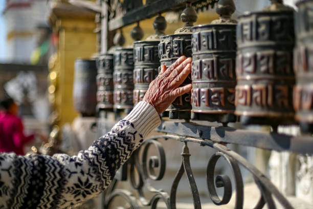 istock Woman and Prayer Wheels 1076480062