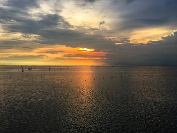 istock sunset reflection on the sea. Soft focus background 1076480288