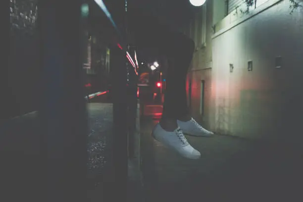 Photo of Crop person on fence on street