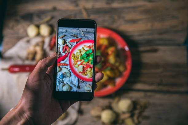 istock Photographing fried potatoes with a smart phone 1076483400