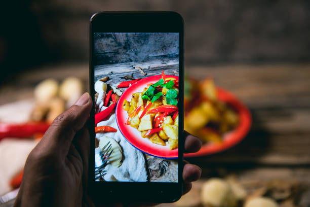 istock Photographing fried potatoes with a smart phone 1076483482