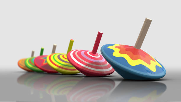 istock Spinning colorful toy tops 1076486128