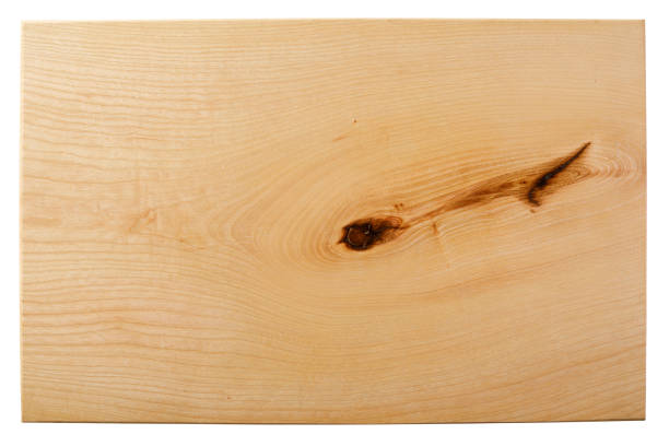 New rectangular wooden cutting board on wooden table background. Top view. Mockup for food project