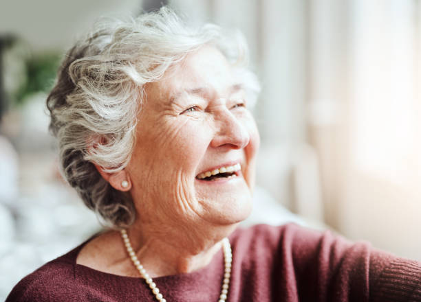 Smiling keeps the soul young Shot of happy senior woman living in a retirement home 80 89 years stock pictures, royalty-free photos & images
