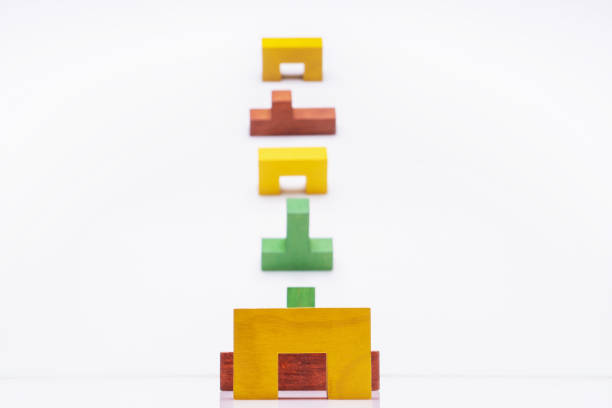 istock Abstract Background. Different colorful shapes wooden blocks on white background. 1076494828