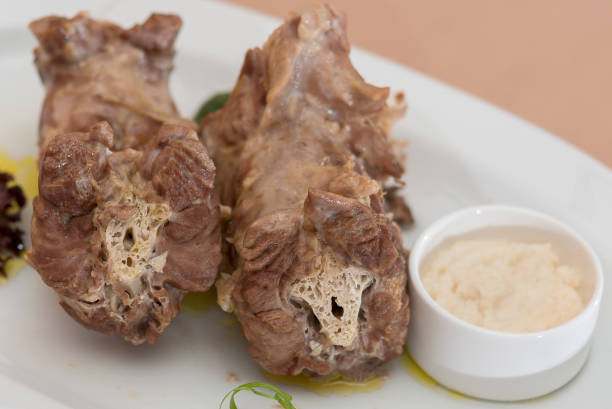 istock Turkey necks,  served with horseradish puree,  placed on white plate,  light background,  isolated 1076502580