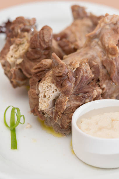 istock Turkey necks,  served with horseradish puree,  placed on white plate,  light background,  isolated 1076502590