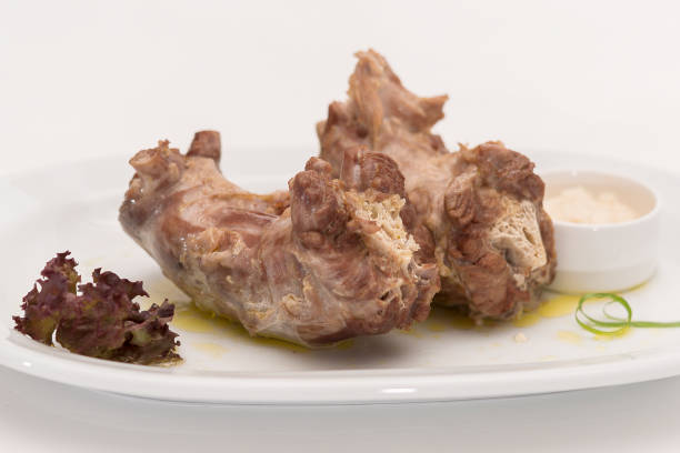 istock Turkey necks,  served with horseradish puree,  placed on white plate,  light background,  isolated 1076502606