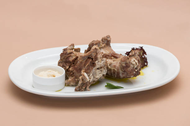istock Turkey necks,  served with horseradish puree,  placed on white plate,  light background,  isolated 1076502612
