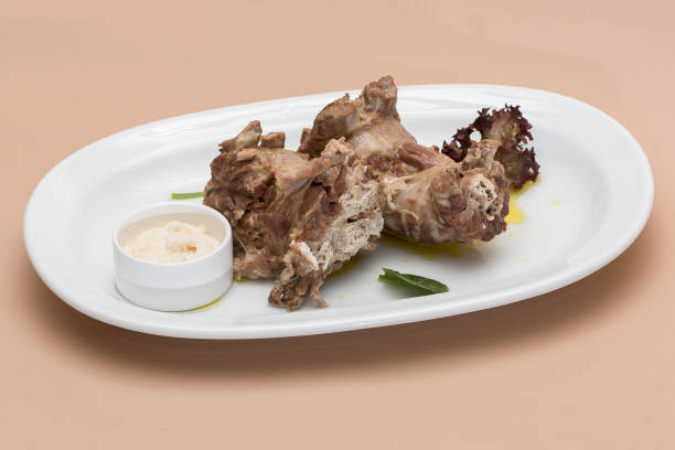 istock Turkey necks,  served with horseradish puree,  placed on white plate,  light background,  isolated 1076502626