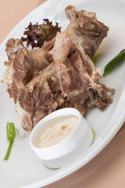 istock Turkey necks,  served with horseradish puree,  placed on white plate,  light background,  isolated 1076502634