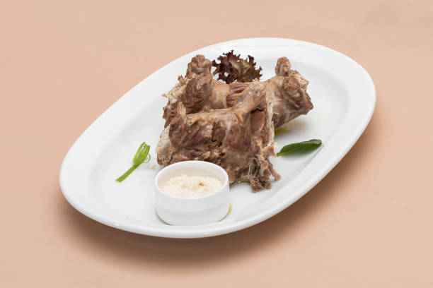 istock Turkey necks,  served with horseradish puree,  placed on white plate,  light background,  isolated 1076502646