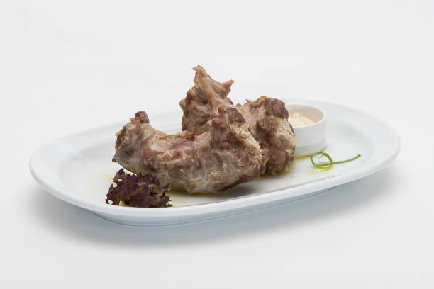 istock Turkey necks,  served with horseradish puree,  placed on white plate,  light background,  isolated 1076502694