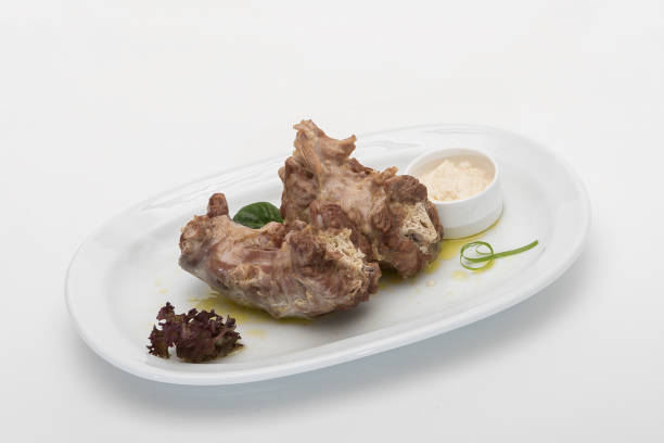 istock Turkey necks,  served with horseradish puree,  placed on white plate,  light background,  isolated 1076502704