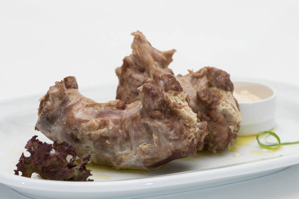 istock Turkey necks,  served with horseradish puree,  placed on white plate,  light background,  isolated 1076502710