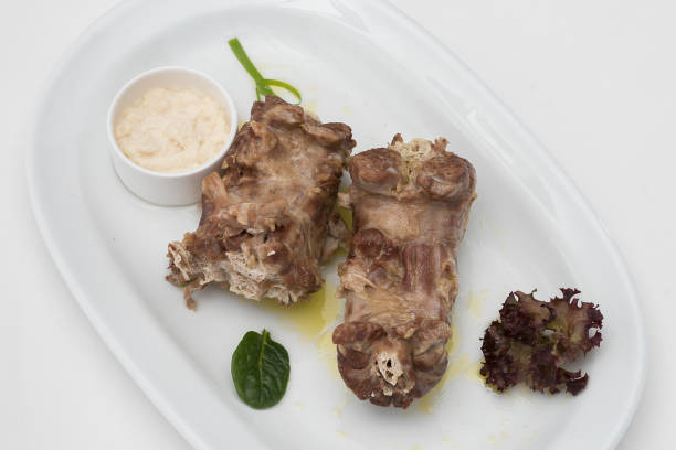 istock Turkey necks,  served with horseradish puree,  placed on white plate,  light background,  isolated 1076502720
