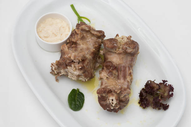 istock Turkey necks,  served with horseradish puree,  placed on white plate,  light background,  isolated 1076502738