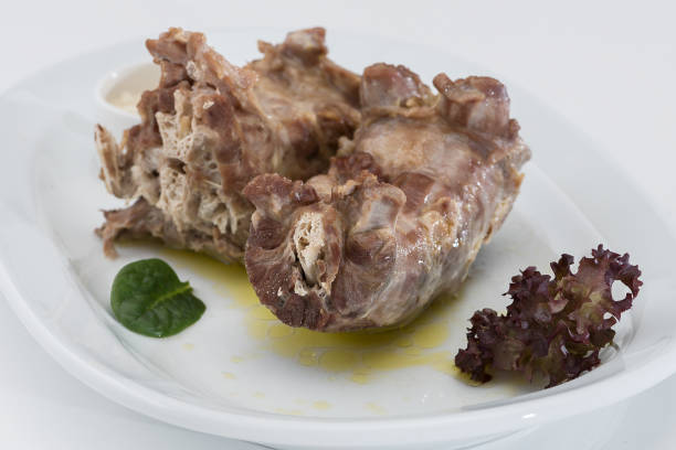 istock Turkey necks,  served with horseradish puree,  placed on white plate,  light background,  isolated 1076502754