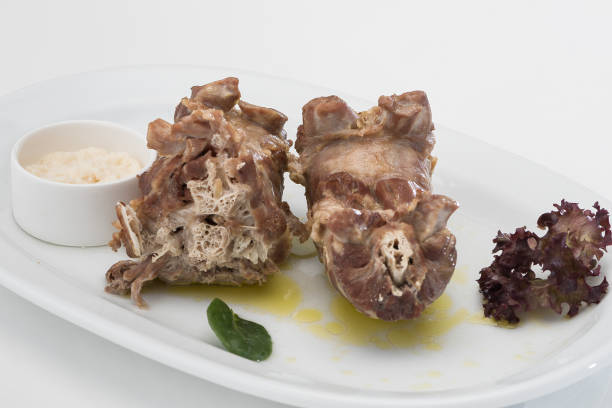 istock Turkey necks,  served with horseradish puree,  placed on white plate,  light background,  isolated 1076502762