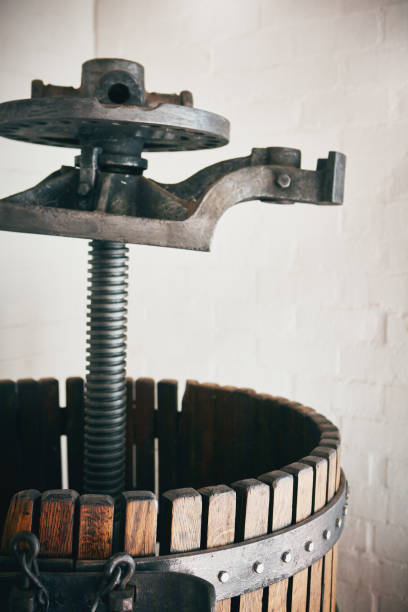 The traditional wooden basket style press used to crush grapes in winemaking.