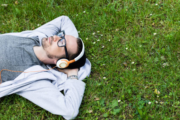 istock Daydreaming with music in springtime. 1076511532