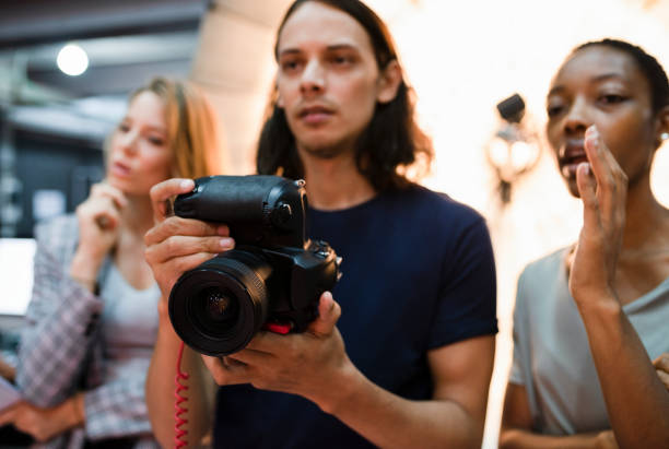istock Photographers shooting in a studio 1076515126