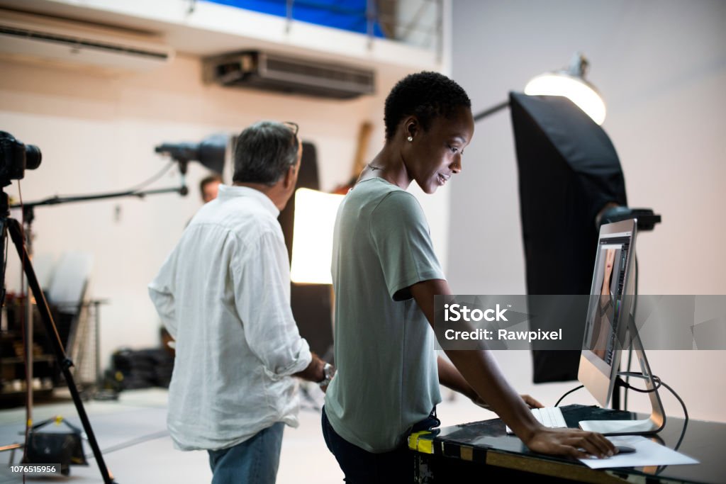 Artists working in a studio Film Crew Stock Photo