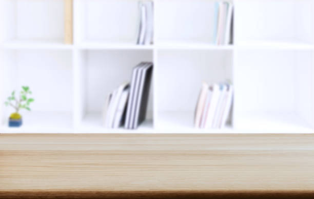 istock Selected focus empty old wooden table and Library or Bookstore blur background with bokeh image. for your photomontage or product display 1076517560